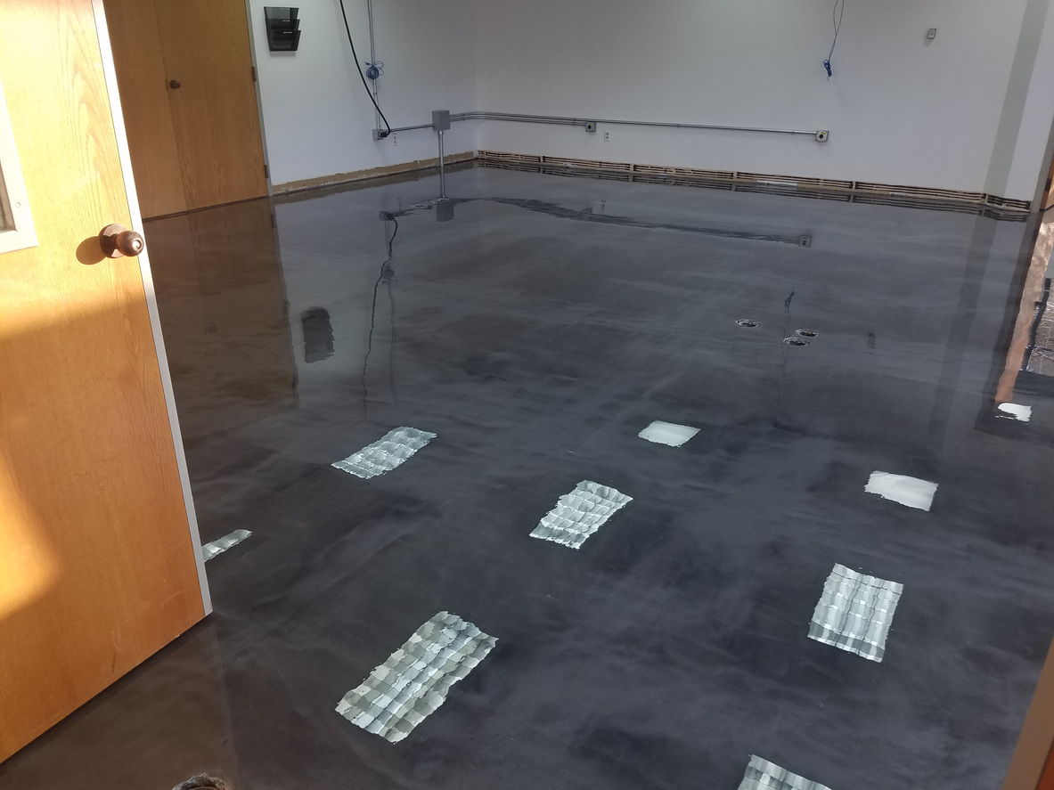 Seamless epoxy floor coating in an Austin home basement and interior living space